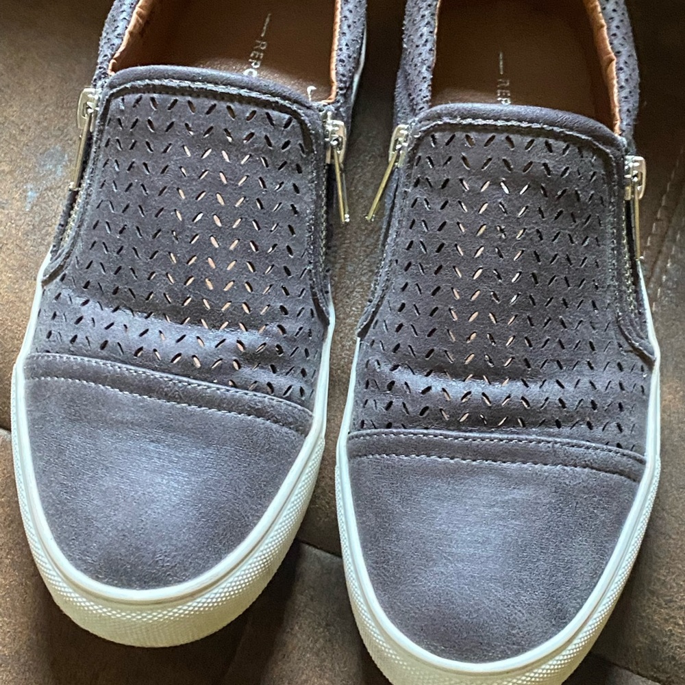Grey slip on sneakers. Like new wore once. Didn’t fit like I wanted.